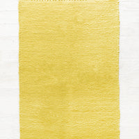 Sulfur: Cotton flatweave rug in solid color yellow green with slight texture, fringe trim on two ends