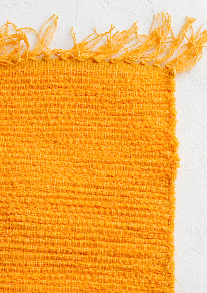 Mango: A textured cotton rug in mango orange.
