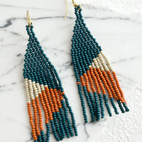 Dark Teal / Terracotta Multi: A pair of colorblocked beaded earrings with geometric design.