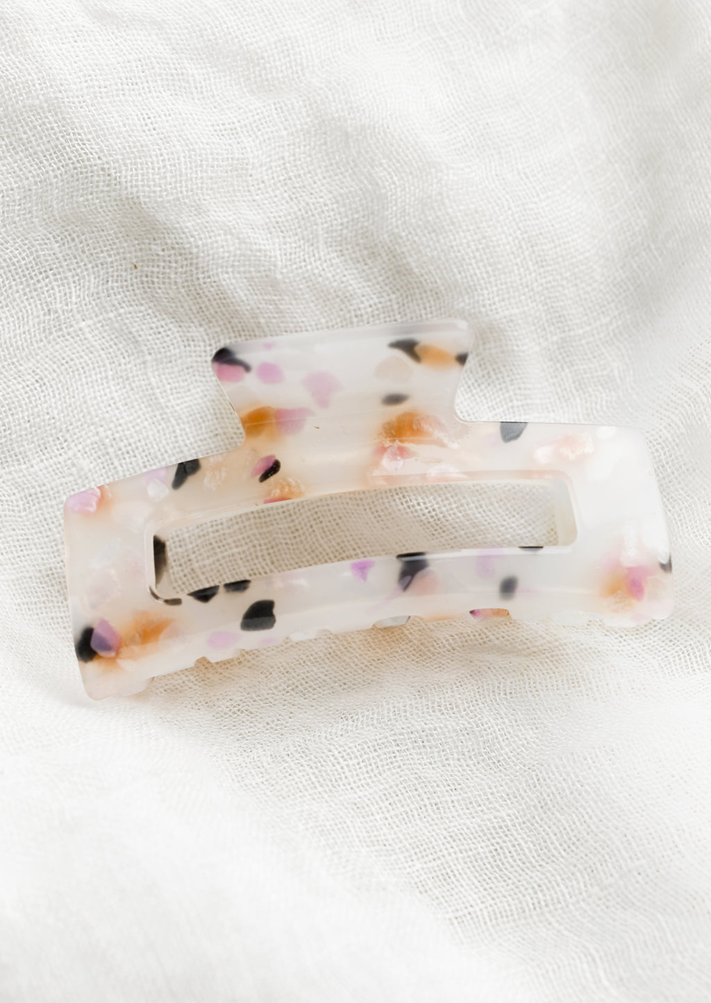 Pink Multi: A color fleck hair claw in pink multi.