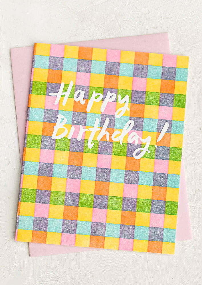 A checkered print card reading "Happy birthday!".