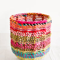 Extra Small: Round, circular storage bin made from colorful recycled fabrics woven together.