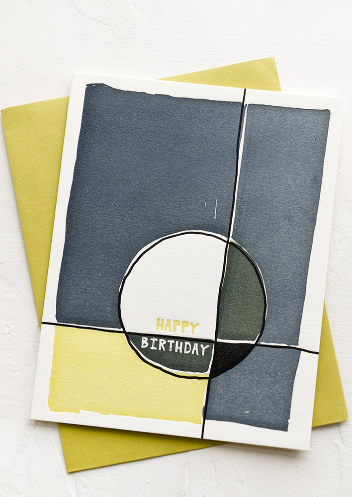 1: A birthday card with abstract design in blue and green.