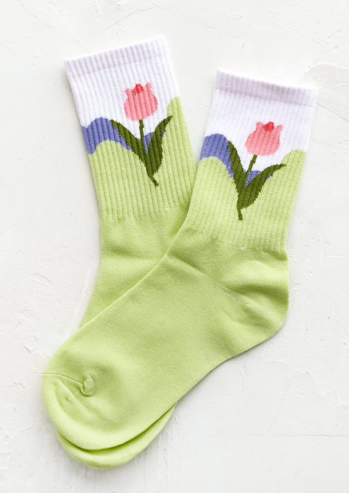 Lime Green: A pair of socks in lime green with pink tulip design at ankle.