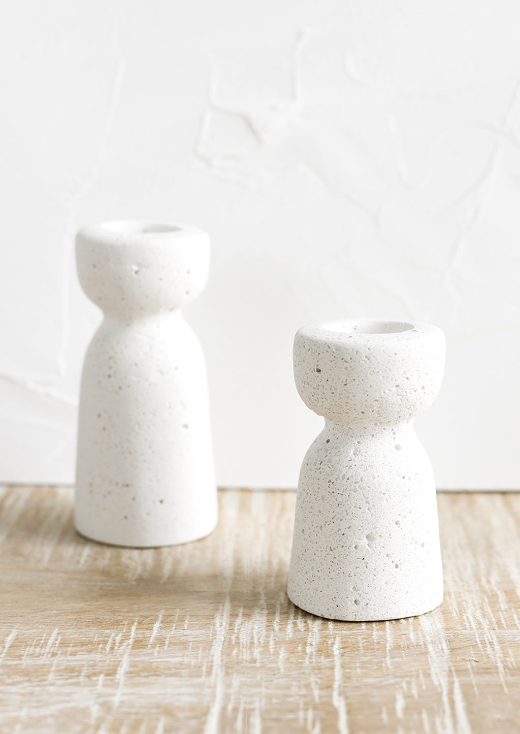 Short / White: Two short and tall white concrete candleholders with pumice-like texture.