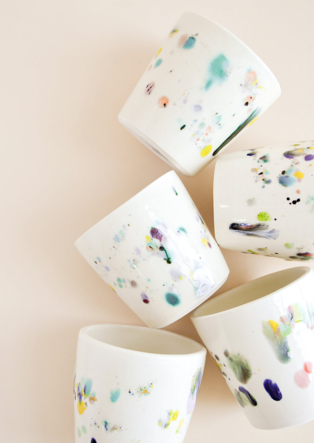 1: Small, one of a kind ceramic tumblers in ivory with colorful drips