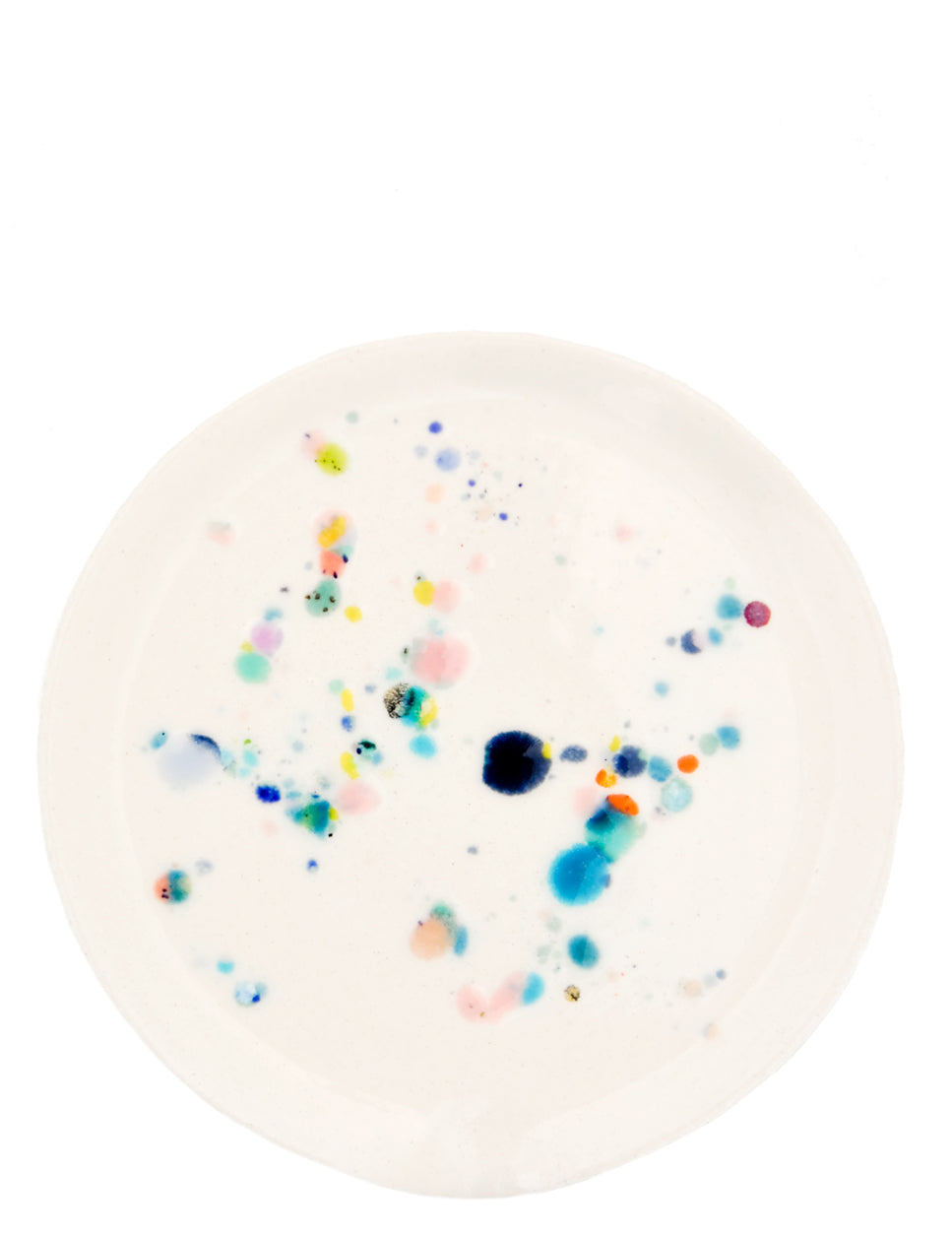 3: A round ceramic spoon rest with random, colorful glaze drips.