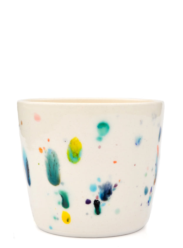 2: Short ceramic cup with colorful glaze drips