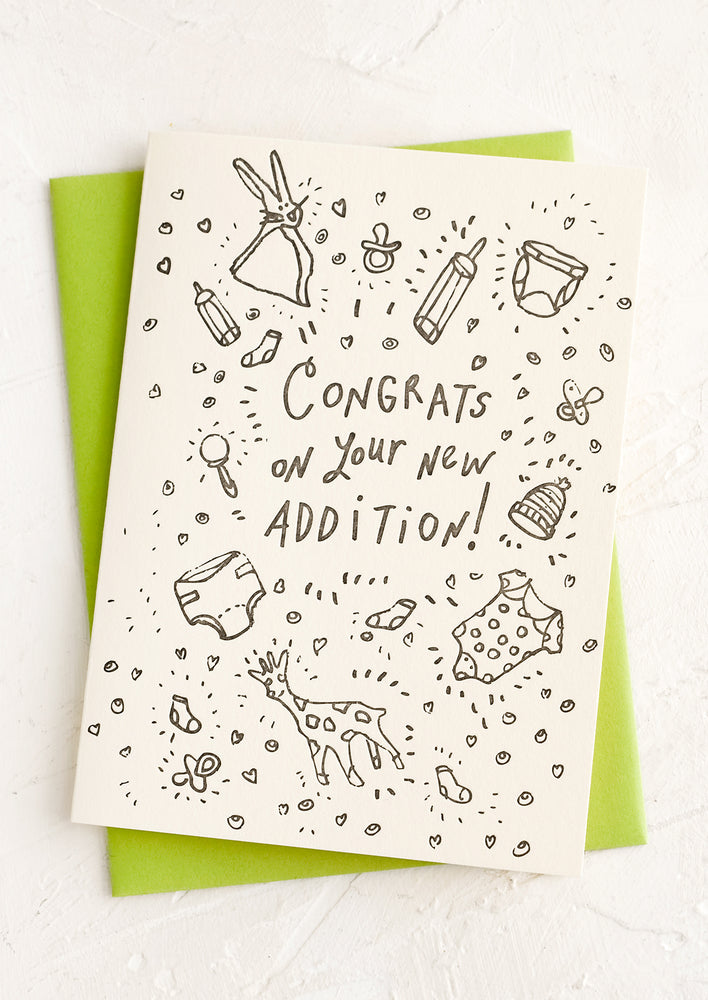 1: A card with icons of baby things and text reading "Congrats on your new addition!".