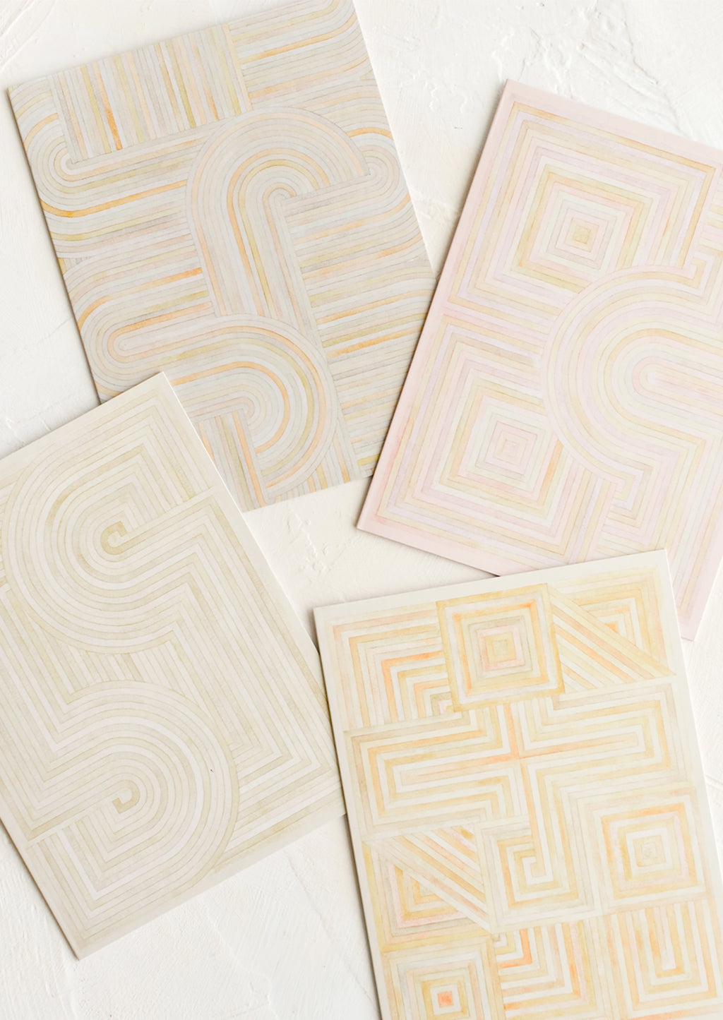 2: Four notecards with pastel geometric artwork design.