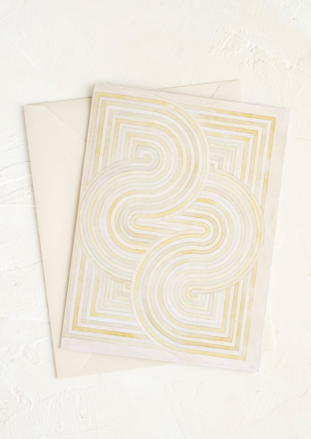 3: A notecard with pastel geometric artwork design.