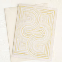 3: A notecard with pastel geometric artwork design.