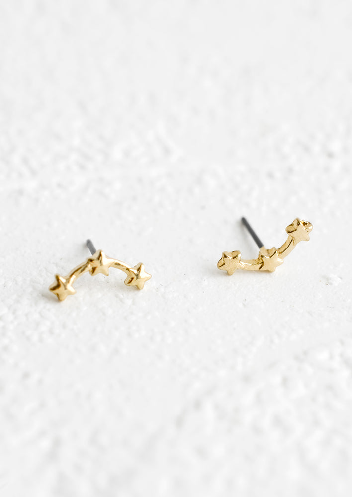 A pair of small stud earrings with shape of gold constellation, linked by star shapes.