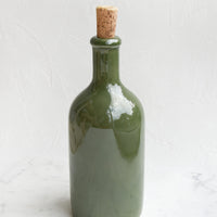 Short / Olive Gloss: A glossy olive colored short bottle with cork top