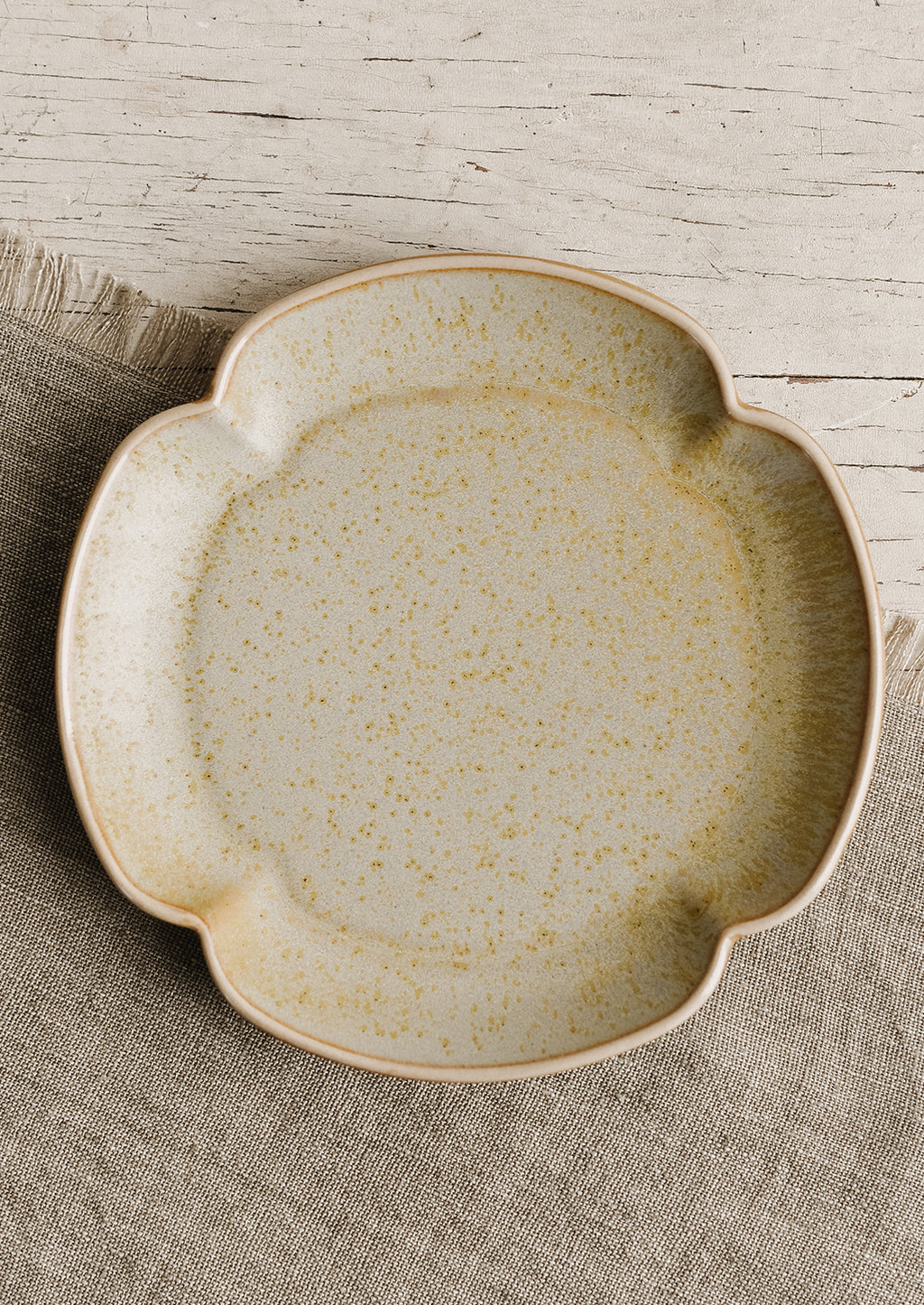 Pale Lichen: A quartrefoil shaped ceramic plate in pale lichen.
