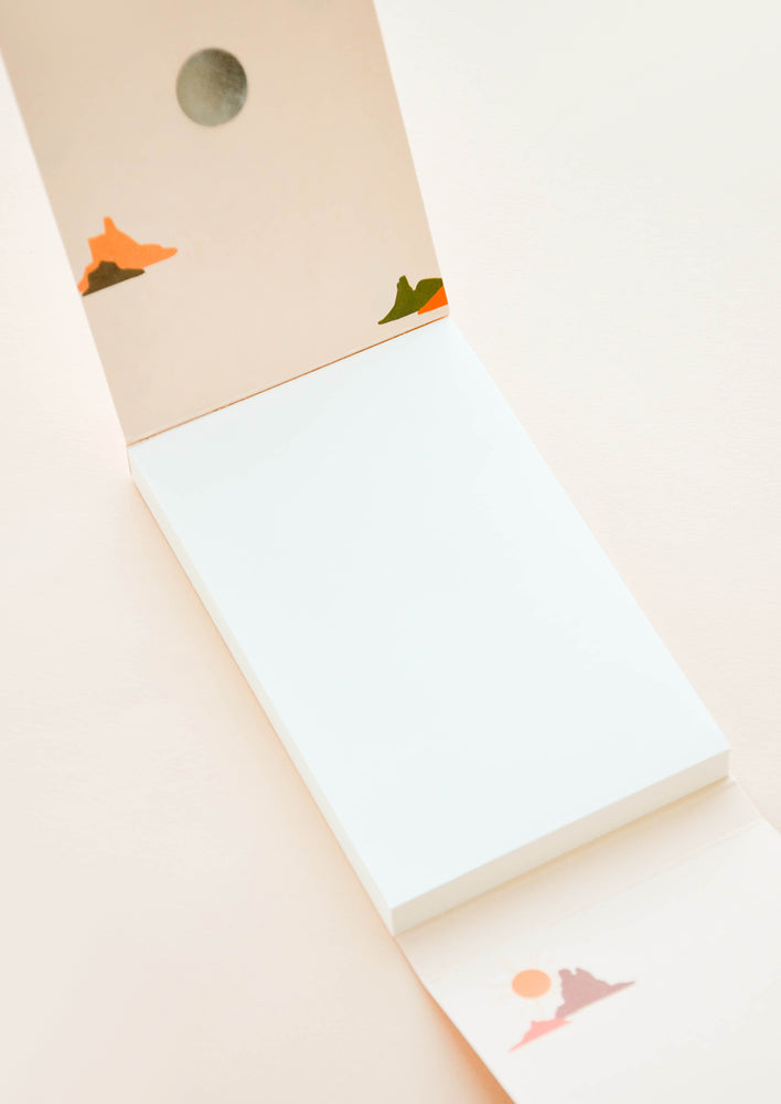 Inside of notebook with blank unruled sheets and desert printed interior