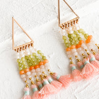 1: A pair of beaded earrings with tassel detail and triangle base.