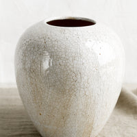 3: An off-white large ceramic vase with crackle pattern.