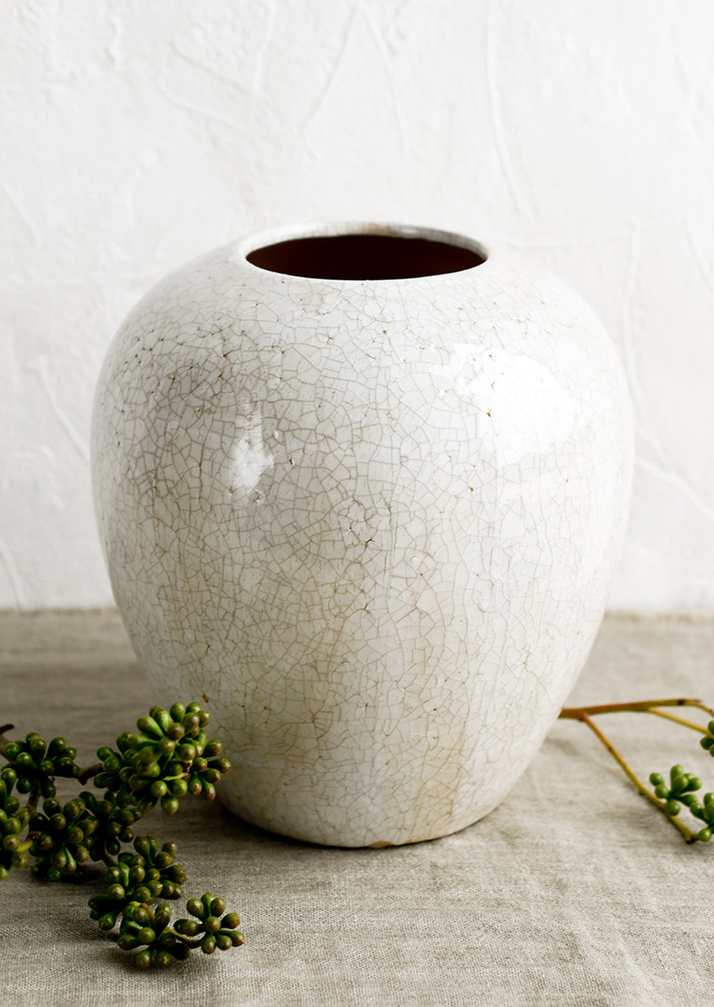 2: An off-white large ceramic vase with crackle pattern.