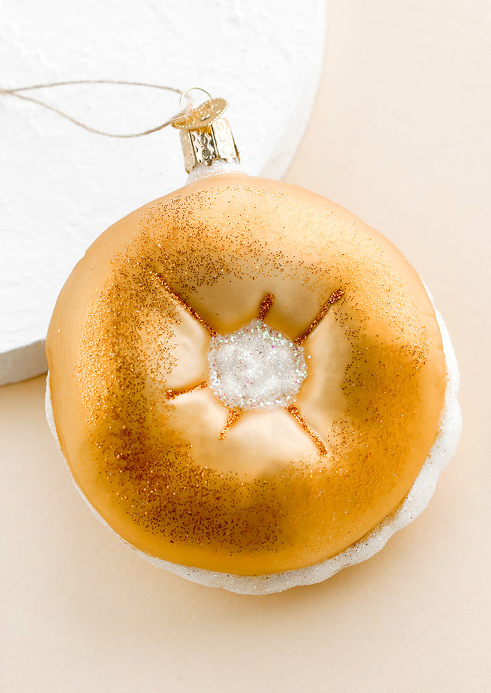 A holiday ornament of plain bagel stuffed with cream cheese.