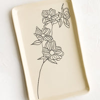 Dogwood: A rectangular ceramic tray in natural bisque color with an etched black drawing of dogwood flower.