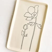 Anemone: A rectangular ceramic tray in natural bisque color with an etched black drawing of anemone flower.