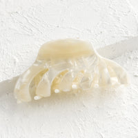 Pearl: A marbled acetate hair clip in pearl.