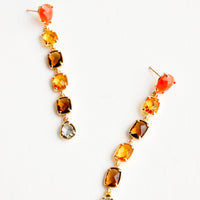 1: Post back drop earrings with six glass crystals of orange, yellow, amber, and blue.