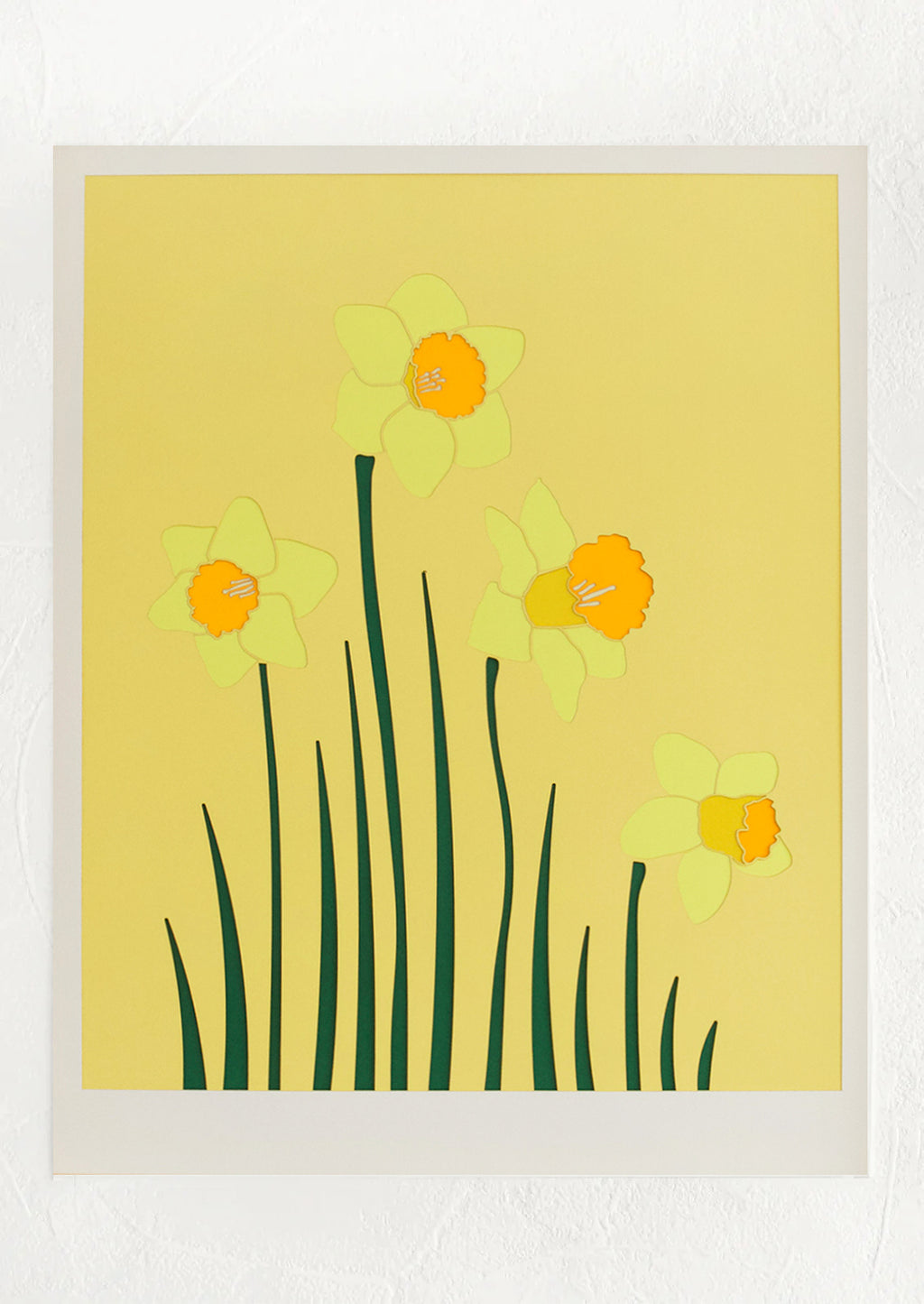 1: A lasercut artwork depicting daffodils on yellow background.