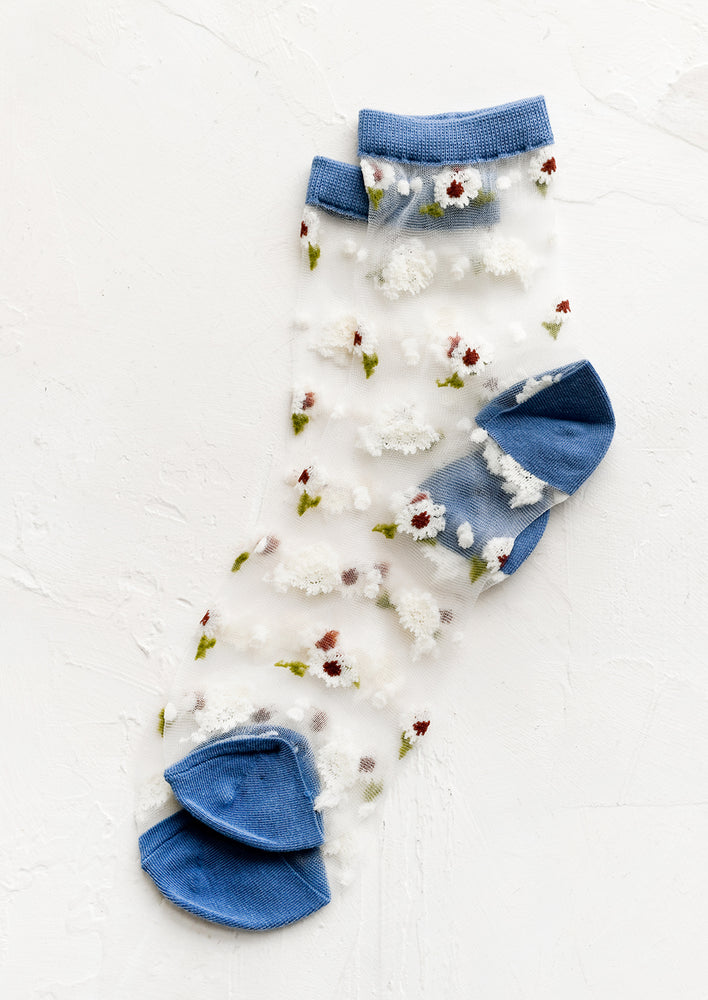 Sheer ankle socks with floral print and blue trim.