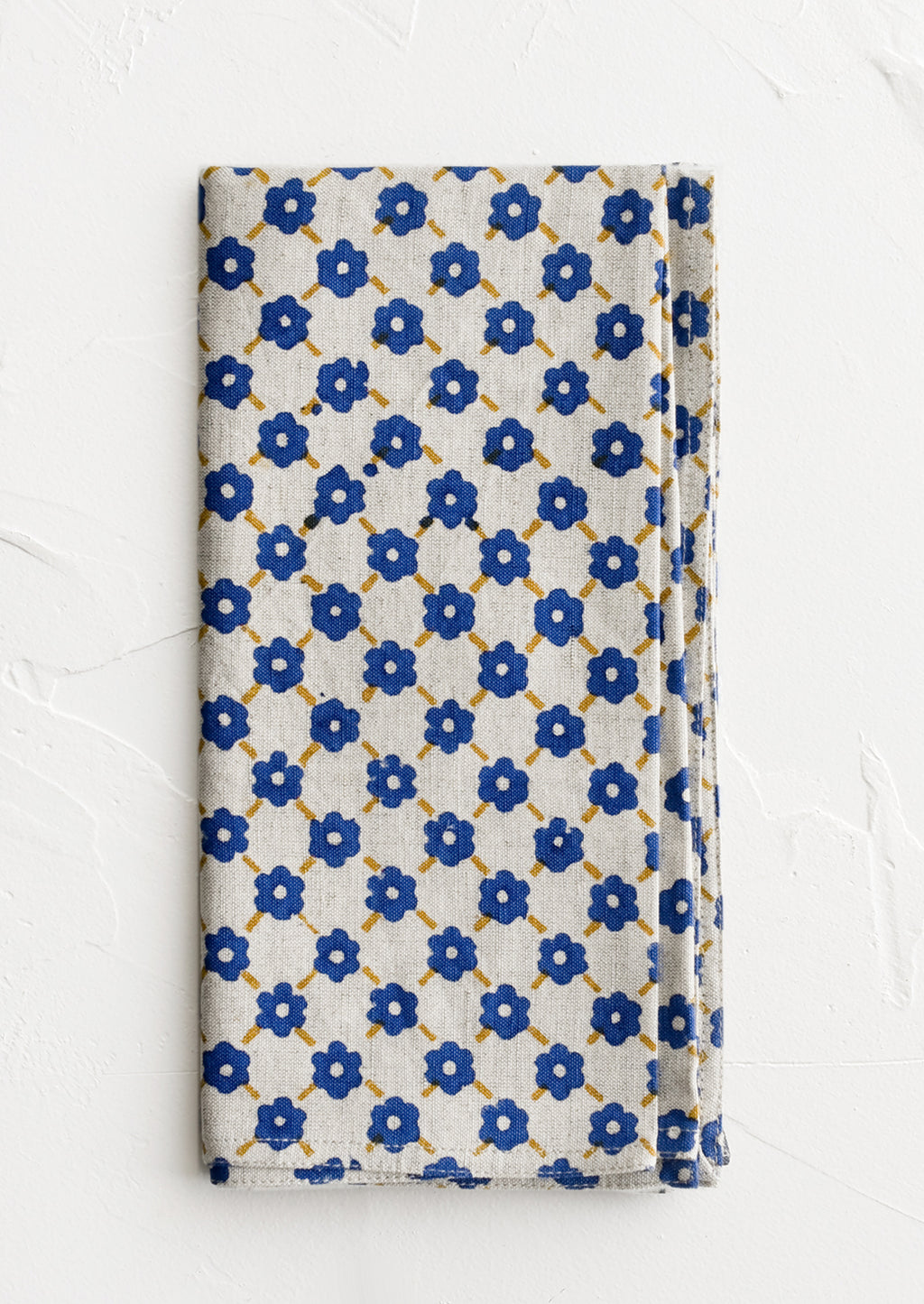 Cobalt Multi: A block printed napkin with blue and yellow floral print.