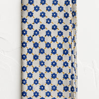 Cobalt Multi: A block printed napkin with blue and yellow floral print.