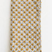 Ochre Multi: A block printed napkin with ochre and cobalt floral print.