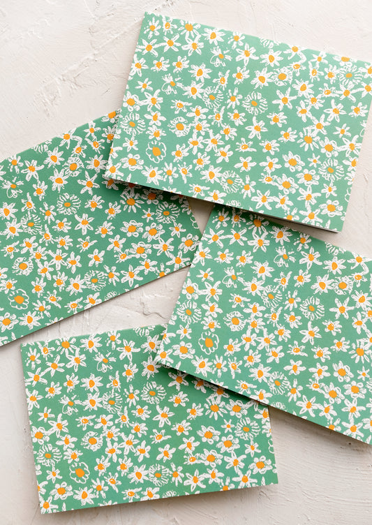 A set of green daisy print cards.