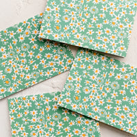 1: A set of green daisy print cards.