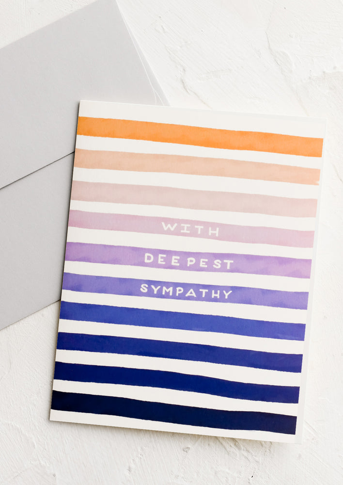 1: A striped greeting card reading "With deepest sympathy".