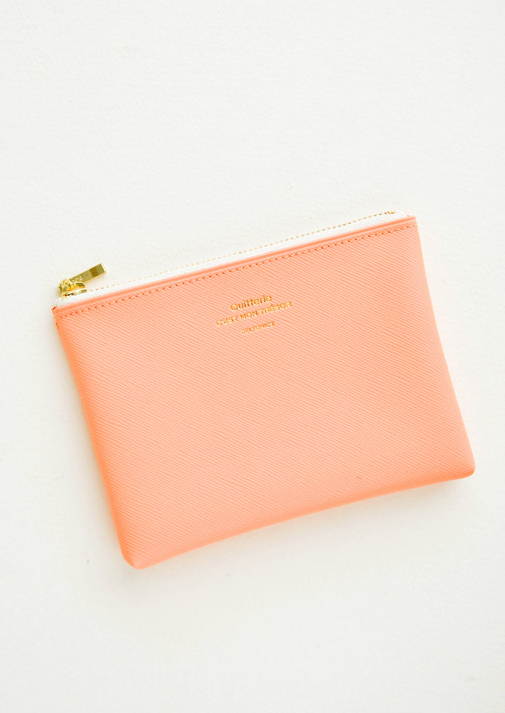 Small vinyl coin pouch with gold zipper and crosshatch texture, in peach.