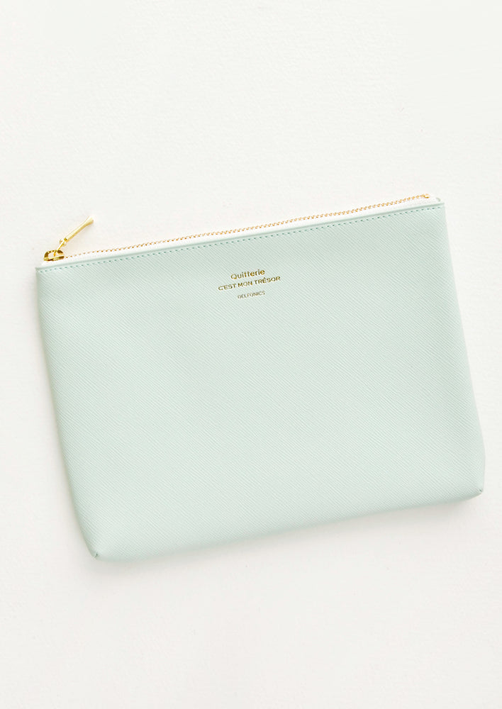 Medium vinyl pouch with gold zipper and crosshatch texture, in mint green.