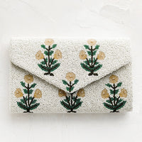 1: A beaded clutch in floral pattern and envelope silhouette.