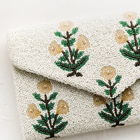 2: A beaded clutch in floral pattern and envelope silhouette.