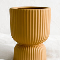 Small / Toffee: A toffee colored vase/planter in curvy silhouette with pinched middle.