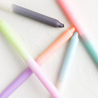 2: Dip dyed taper candles in an assortment of colors.
