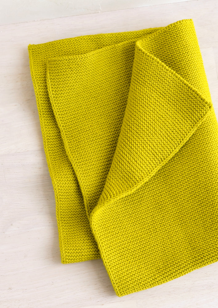 A knit cotton dish towel in citron green.