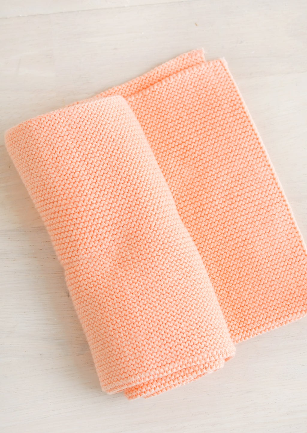 Papaya: A knit cotton dish towel in papaya pink.