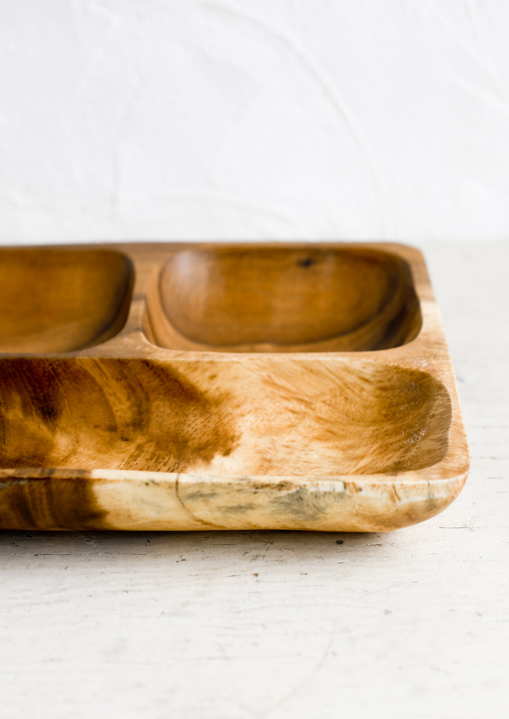 2: A wooden tray with compartments.