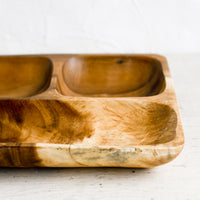 2: A wooden tray with compartments.