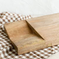 1: A thick mango wood chopping board with divoted section at 1/3.