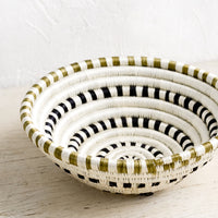 3: A sweetgrass basket in black and white dash pattern.