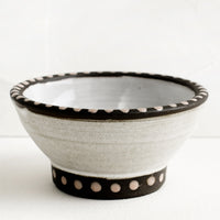 Oyster / Pale Pink: A small ceramic bowl with pink dot painted detailing.