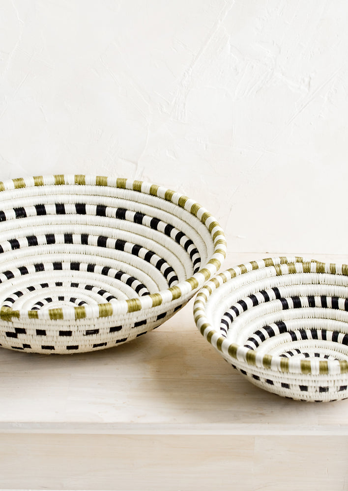 Two sweetgrass baskets in small and large sizes.